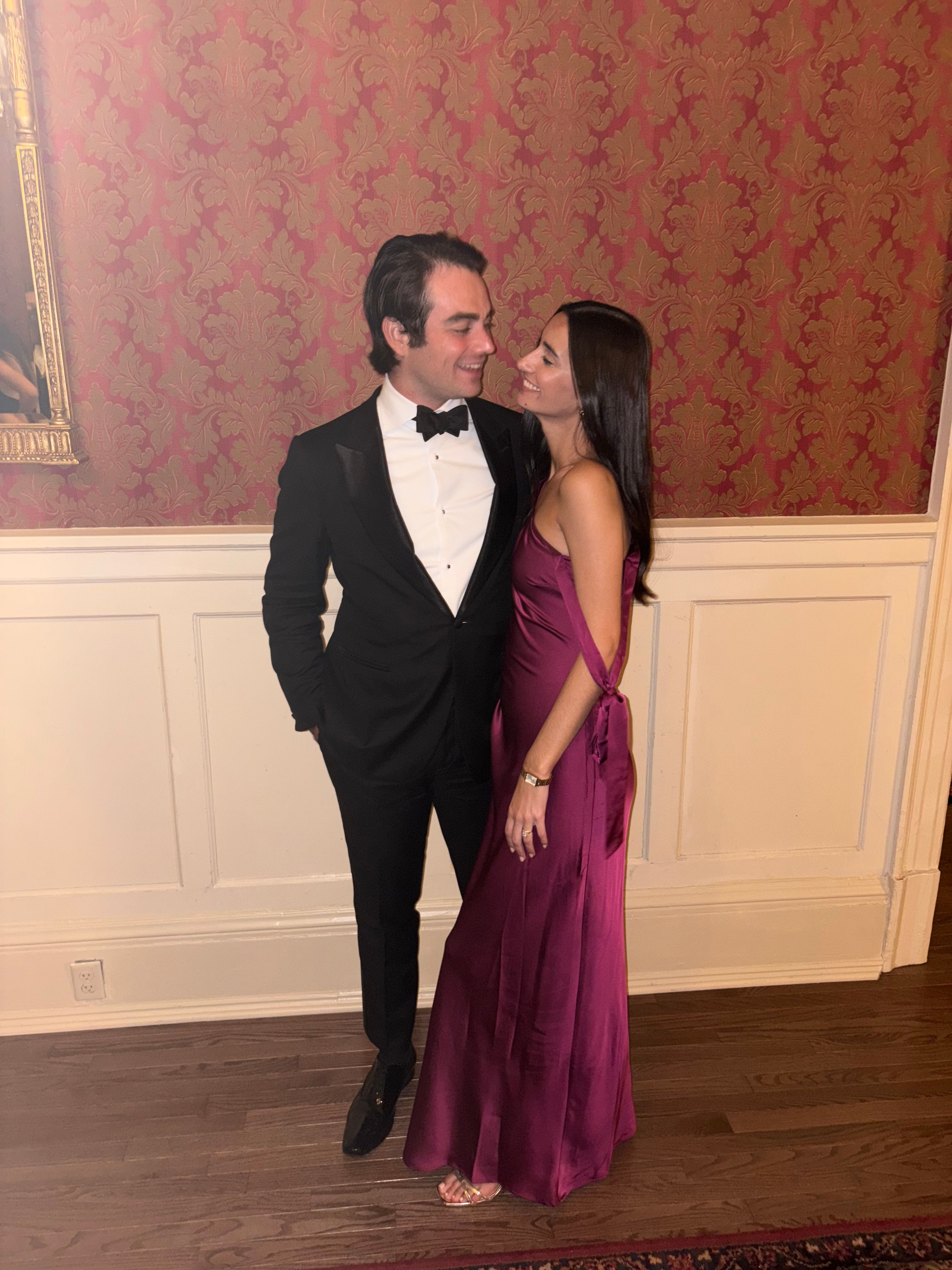 Billy and Iz full-length, looking at each other