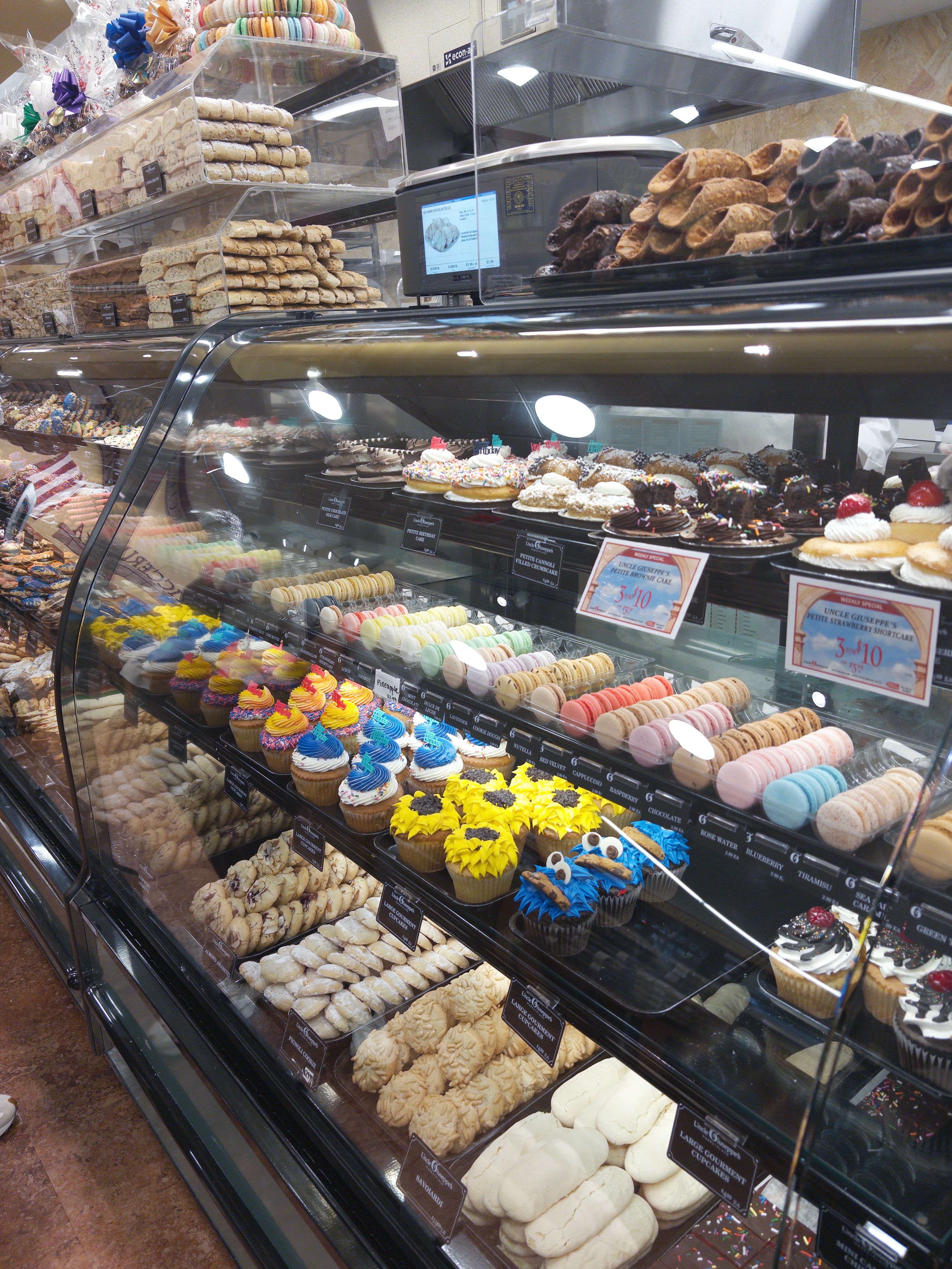 Macarons, cupcakes, and cookies in the bakery case